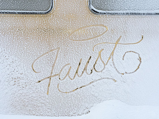 Faust tag in gold snow covered snow-cat